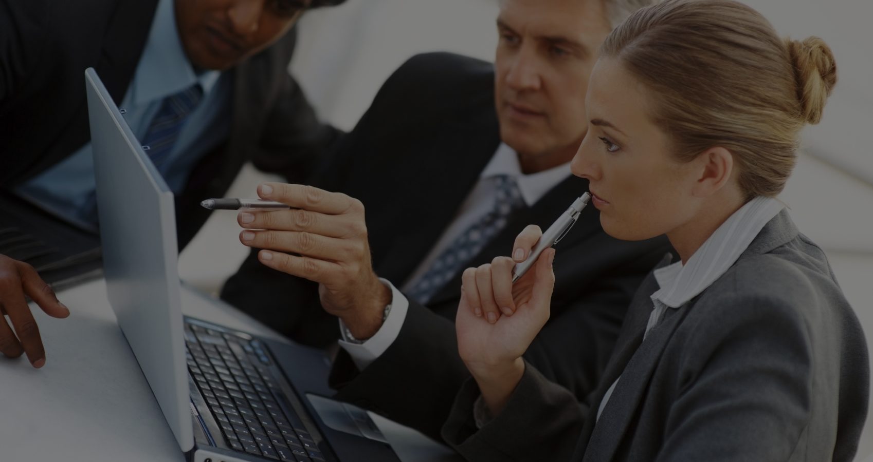 business-people-around-computer